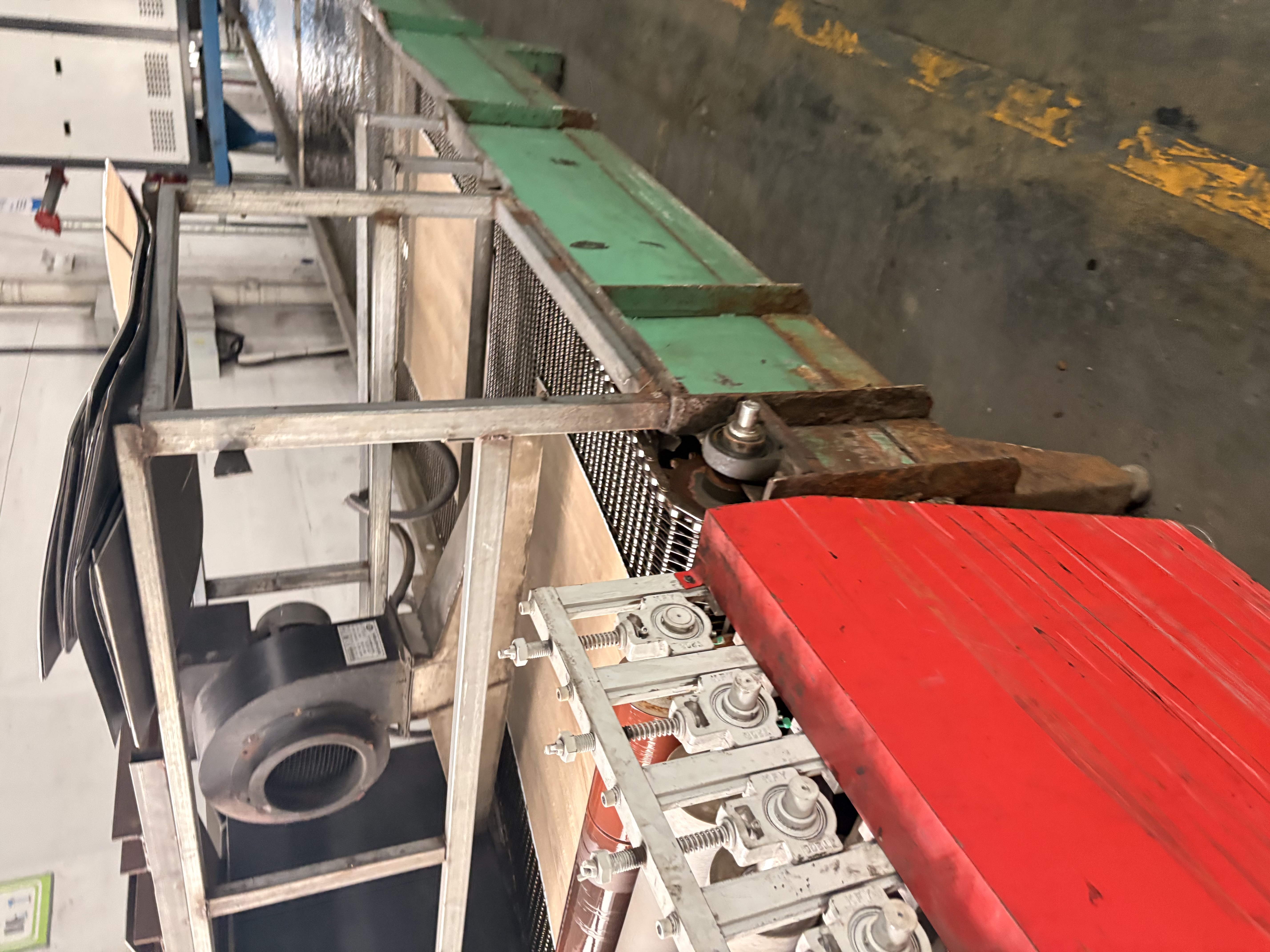 60-degree glossmeter showing a reading on a light oak flooring panel